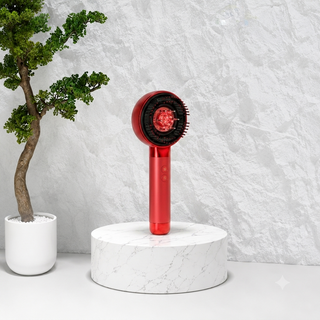 Rechargeable scalp massage comb with light therapy, essential oil applicator, LCD display, and three vibration modes for hair and scalp care.